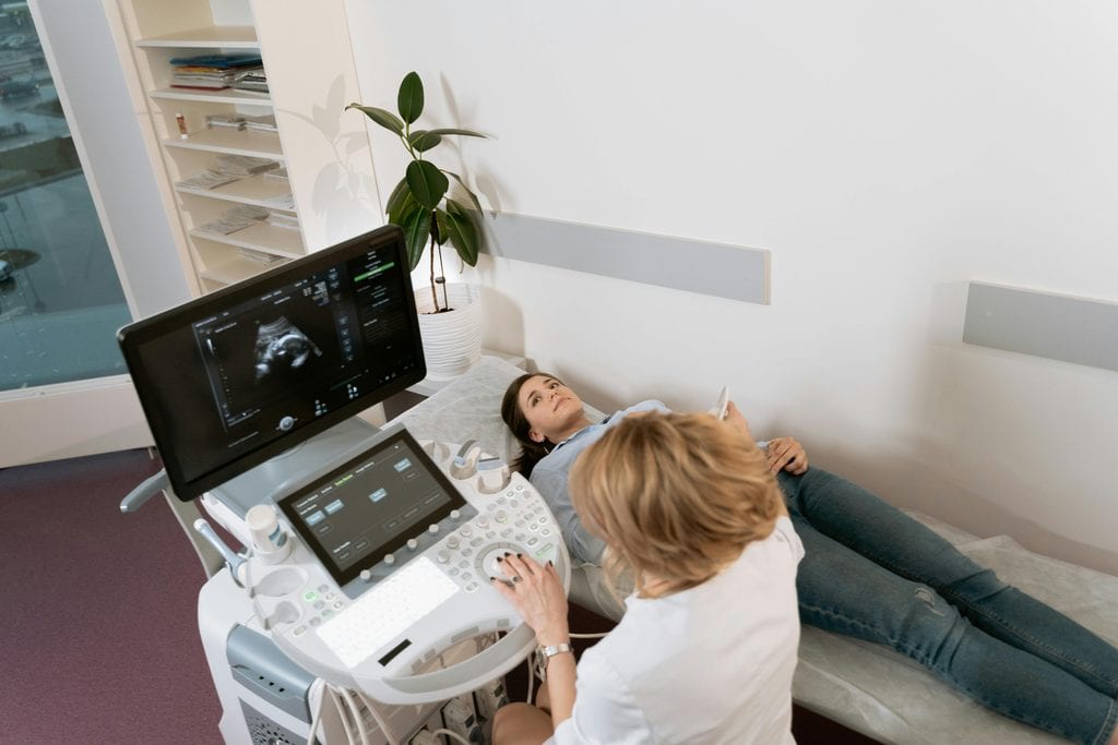 Image on a sonographer conducting an Ultrasound Scan,